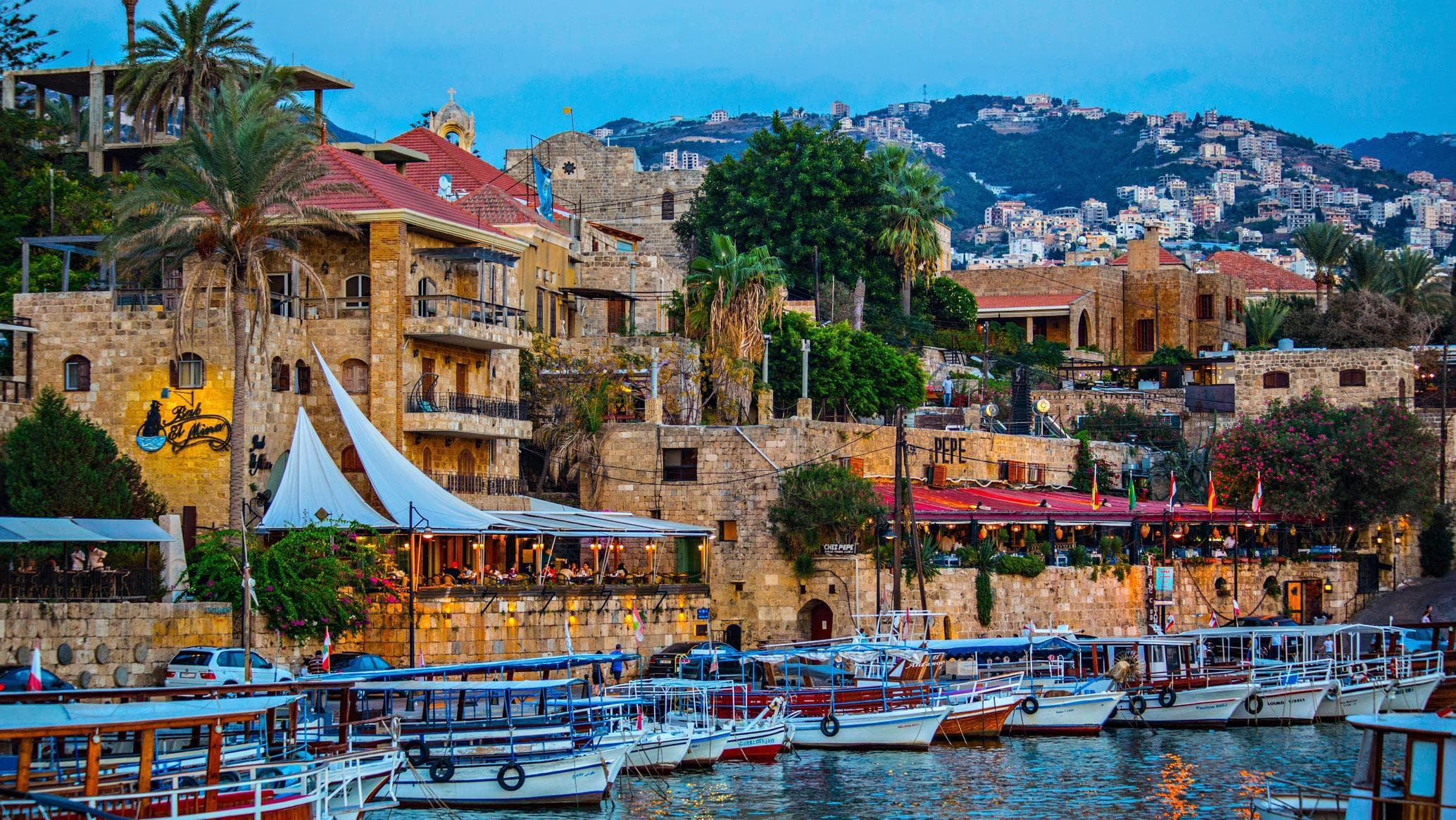 A view of lebanon Mediterranean coastline with hotels and waterfront restaurants under summer light