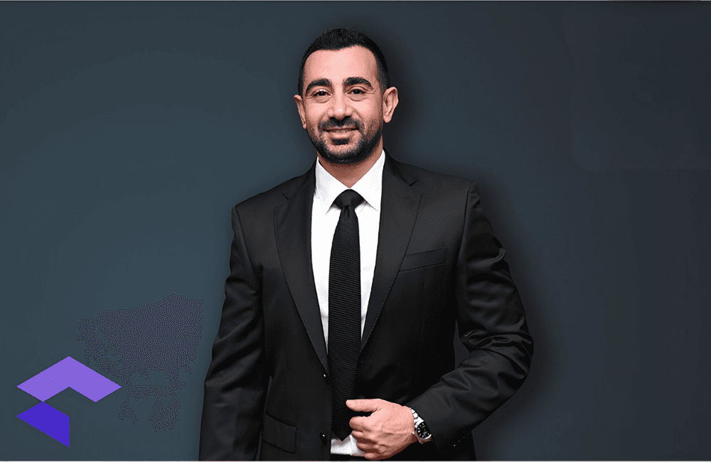 Fares Saab, founder of CompuVision, in the company's Lebanon office, with the CompuVision logo visible infront of him.