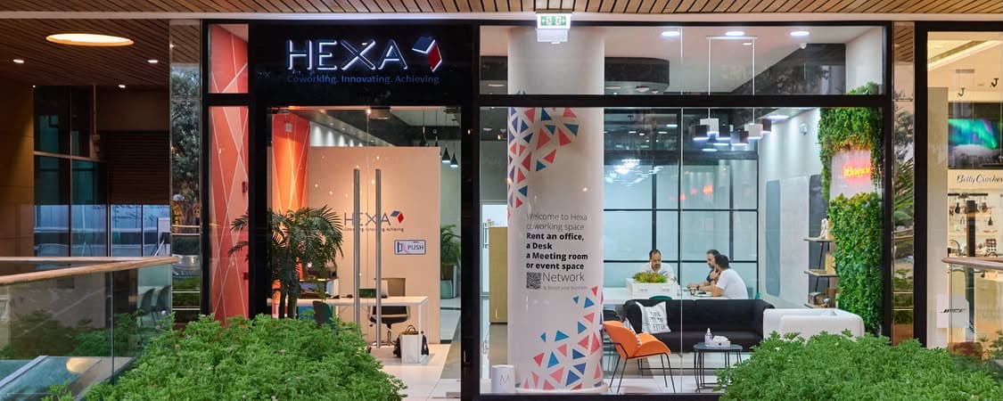 Members working at desks inside Hexa Coworking at Mall