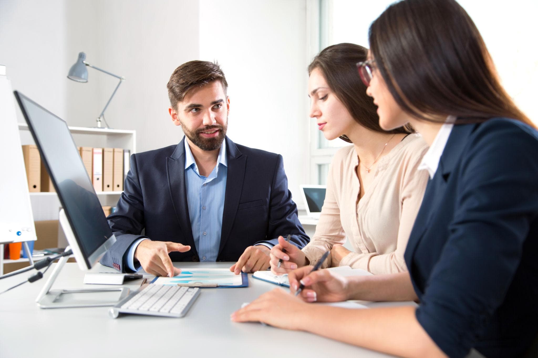 Executives discussing strategy during a corporate meeting.